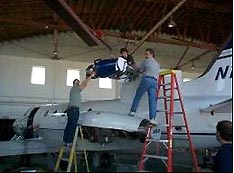 Photo shows the Aviation Classic's team working on an Airframe Pylon Install and Paint for Williams Internationals’ Engine Testbed.
