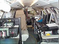 Photo shows Onboard Equipment Installations, Power Requirements, GILL Liner, Workstations & Equipment Racks, Williams International Project.