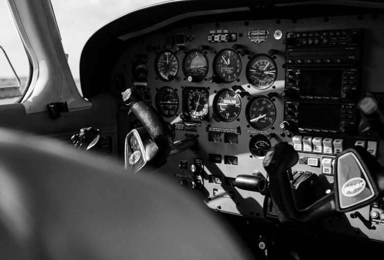 Photo of the avionics setup in the cockpit of an aircraft. The photo is taken from behind and to the right of the pilots seat. Original image by Jose Lebron.
