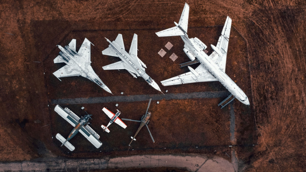Bird's eye view image of various aircrafts parked near each other. Original photo by Vadim Sadovski.