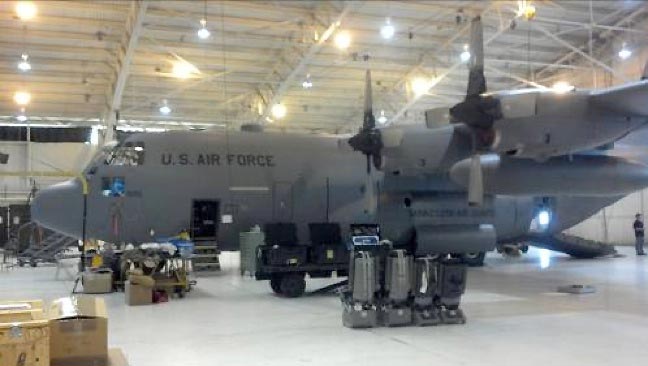 Image of a US Air Force C130 aircraft parked in an Aviation Classics hangar.